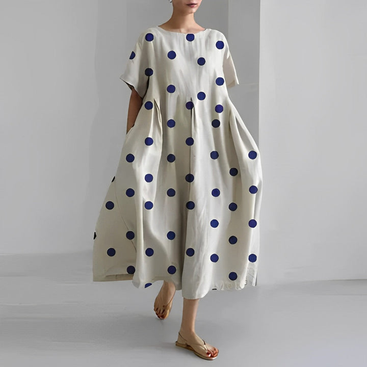 Patterned women's long maxi dress with a vibrant floral design, stylish and comfortable for summer days.