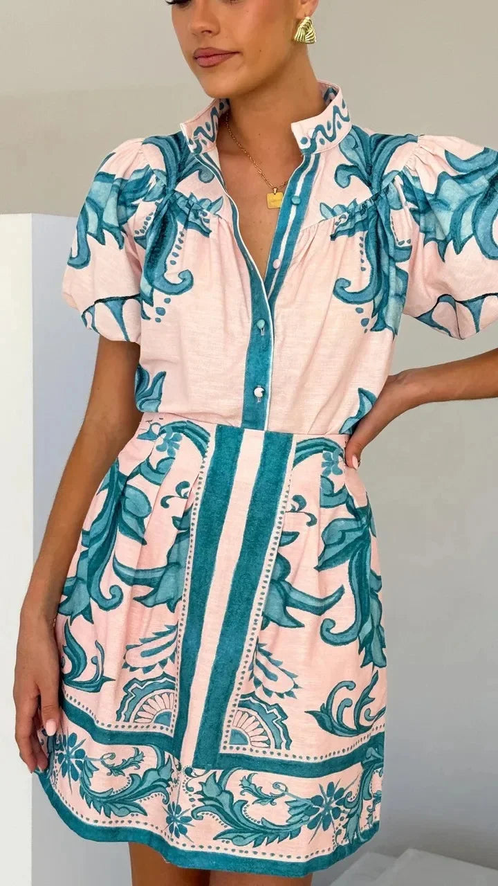 Modern women's vibrant floral puff sleeve mini dress, ideal for special occasions.