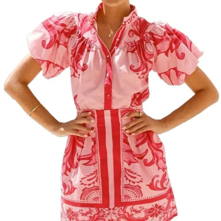 Women's elegant floral puff sleeve cocktail dress, a flattering summer party look.