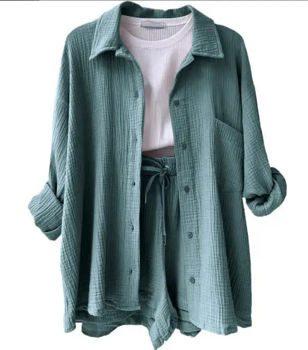 Teal vibrant women's two-piece suit, perfect for a stylish summer look.