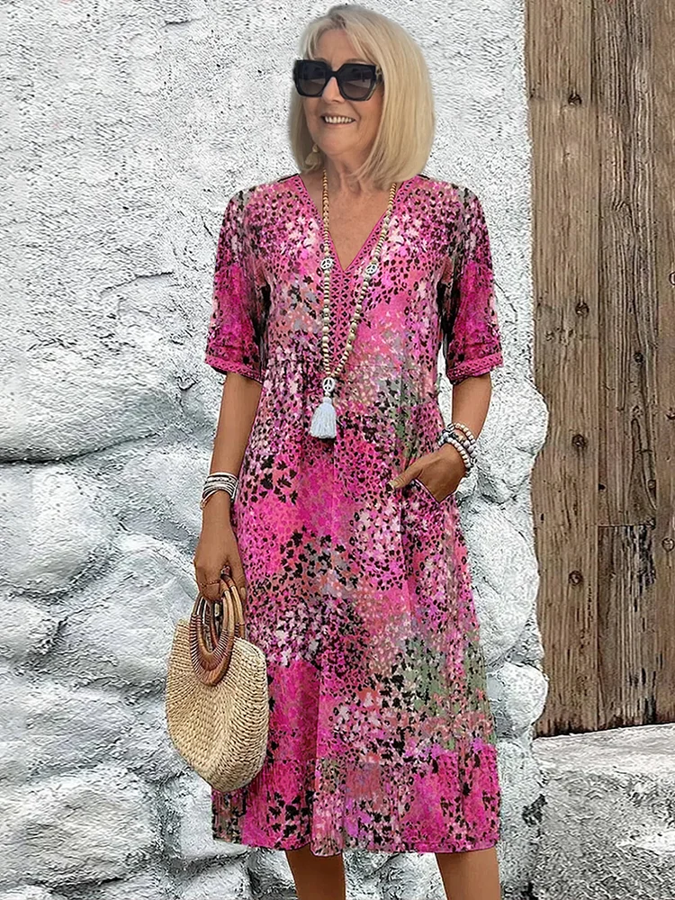 Ladies' vibrant print midi dress featuring a comfortable, flowy design. Ideal for spring/summer fashion.