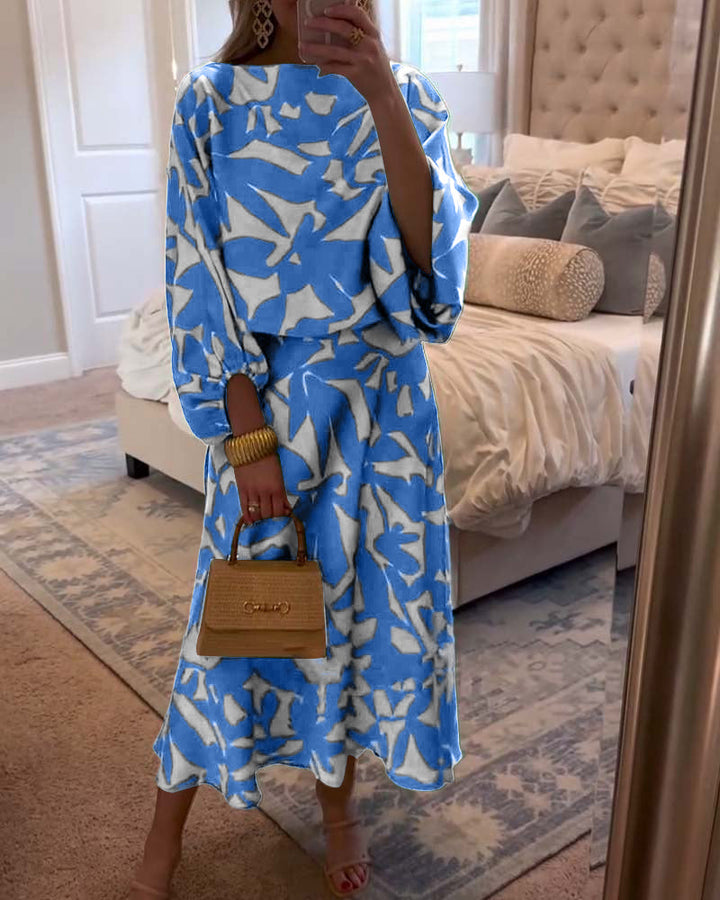 Chic women's matching outfit: printed long-sleeve top & coordinating skirt set, ideal for versatile styling.