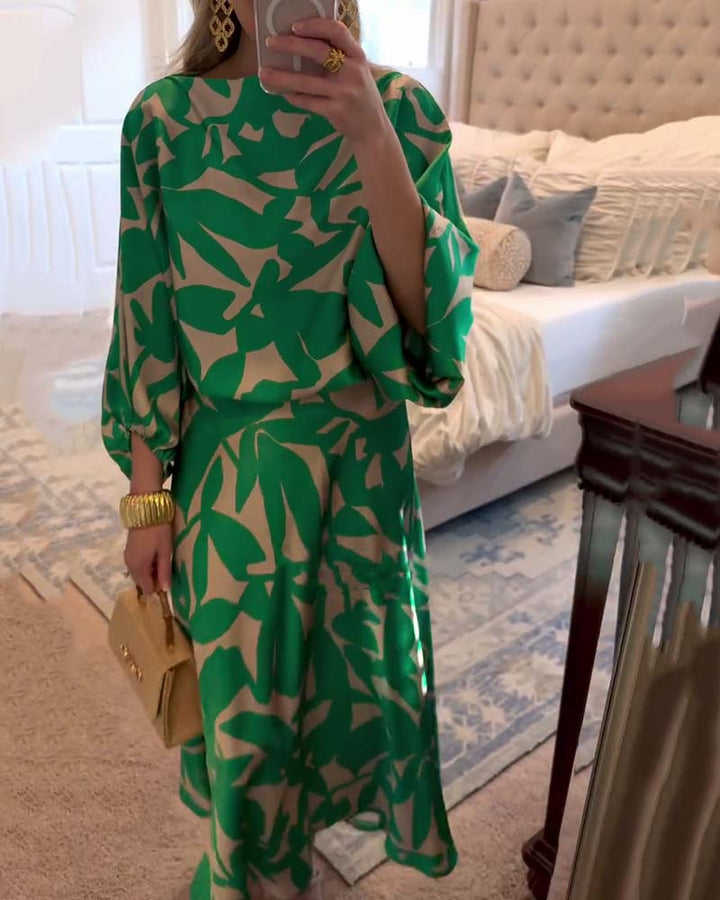 Elegant women's printed two-piece outfit with flowy lantern sleeves, perfect for summer style.