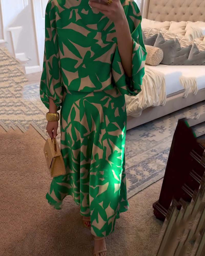 Fashionable women's printed two-piece set with a matching top and skirt, featuring statement lantern sleeves.