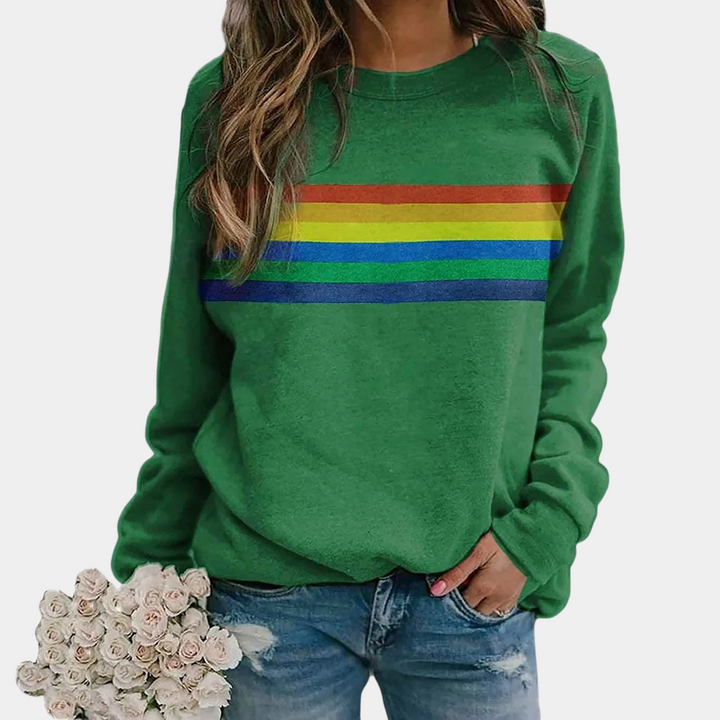 Relaxed fit women's sweatshirt with bold rainbow stripes. Comfy crewneck for loungewear or casual outfits.