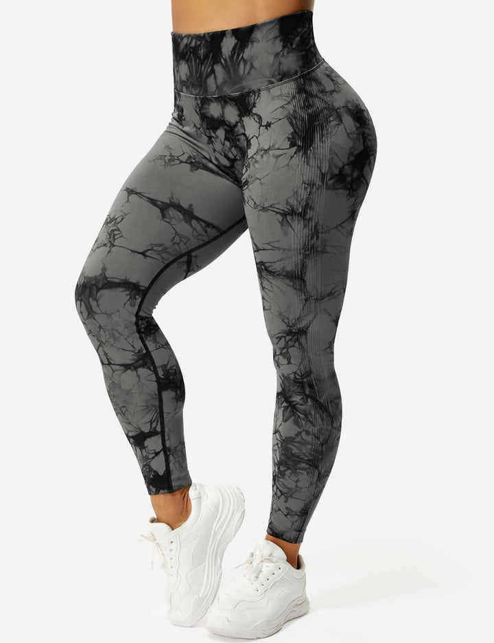 Women's vibrant tie-dye leggings, perfect for yoga & active style. Comfortable high-waist fitness apparel.