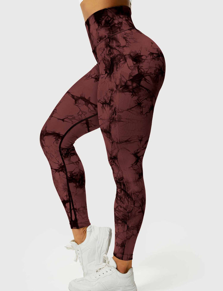 Trendy tie-dye yoga leggings for women. Comfortable activewear, perfect for flexible movement.