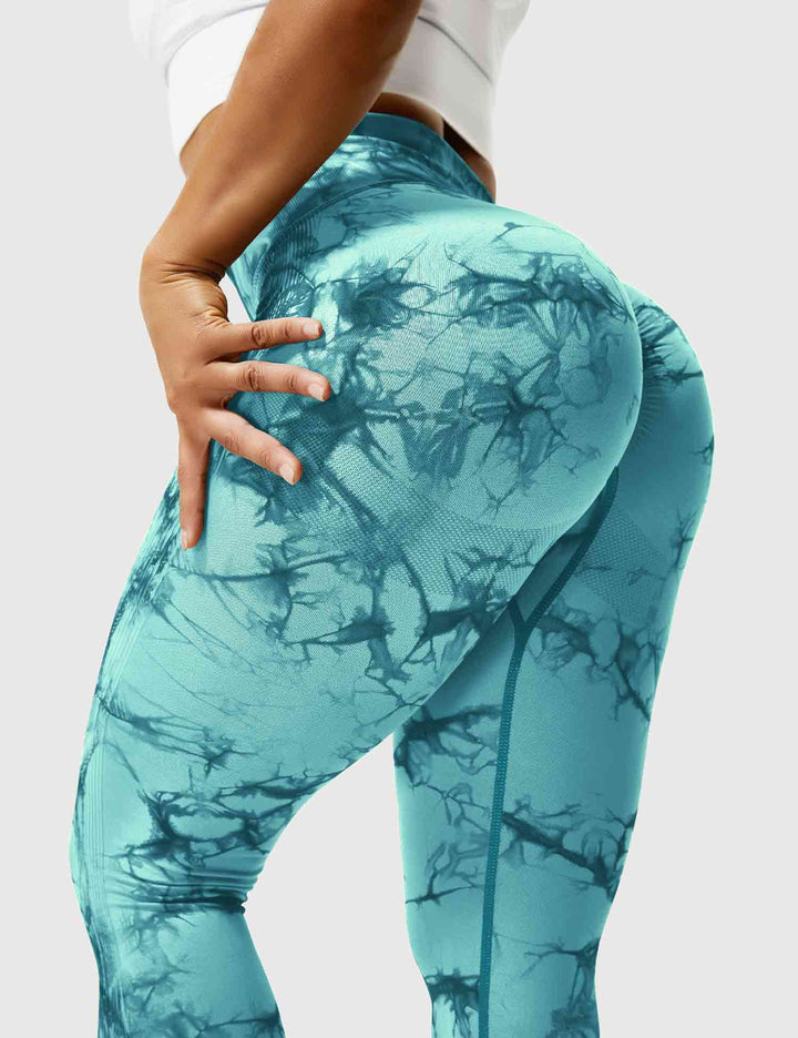 Vibrant tie-dye women's high-waist leggings, offering style & comfort for active lifestyles.