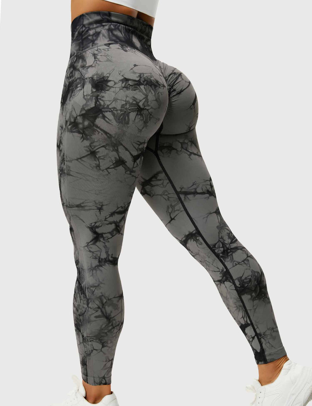 Fashionable women's tie-dye yoga pants. High-waist design for comfortable activewear & fitness.
