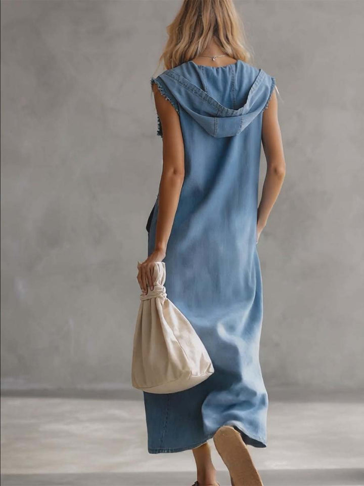 Women's hooded blue midi dress with vintage flair. Features V-neck, zipper, button details, and practical side slits.
