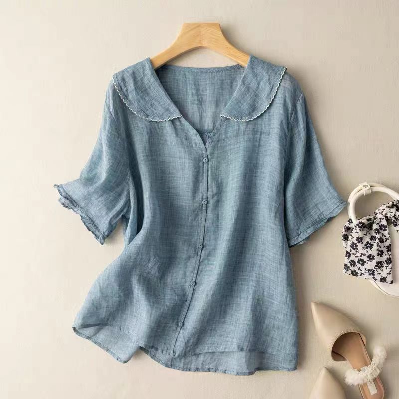 Elegant women's summer top, vintage button blouse with scalloped collar. Relaxed fit for comfortable spring fashion.