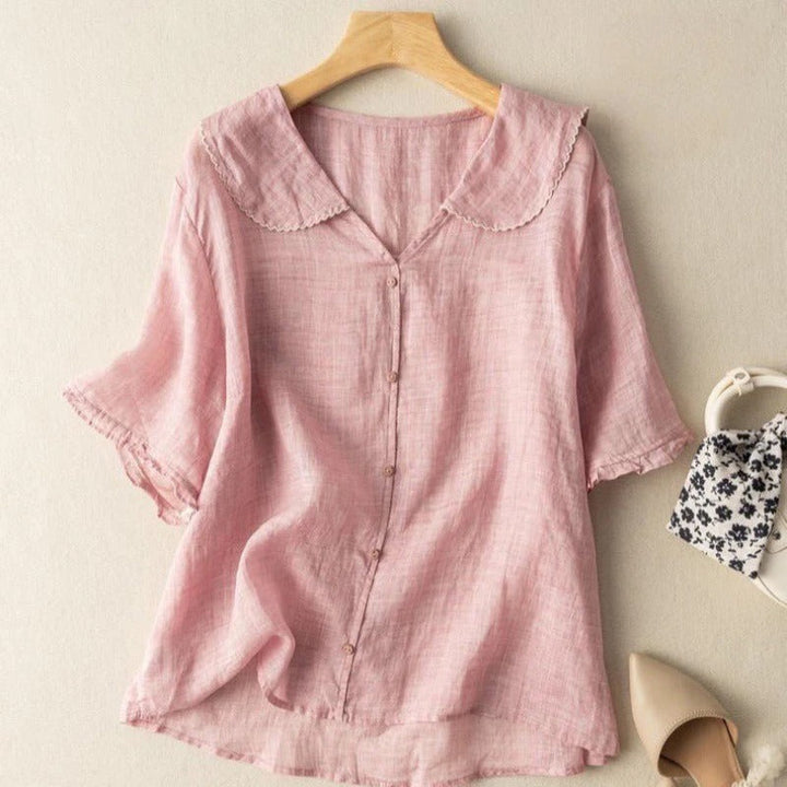 Fashionable women's blouse featuring a vintage button-front design and delicate scalloped collar. Chic and versatile.