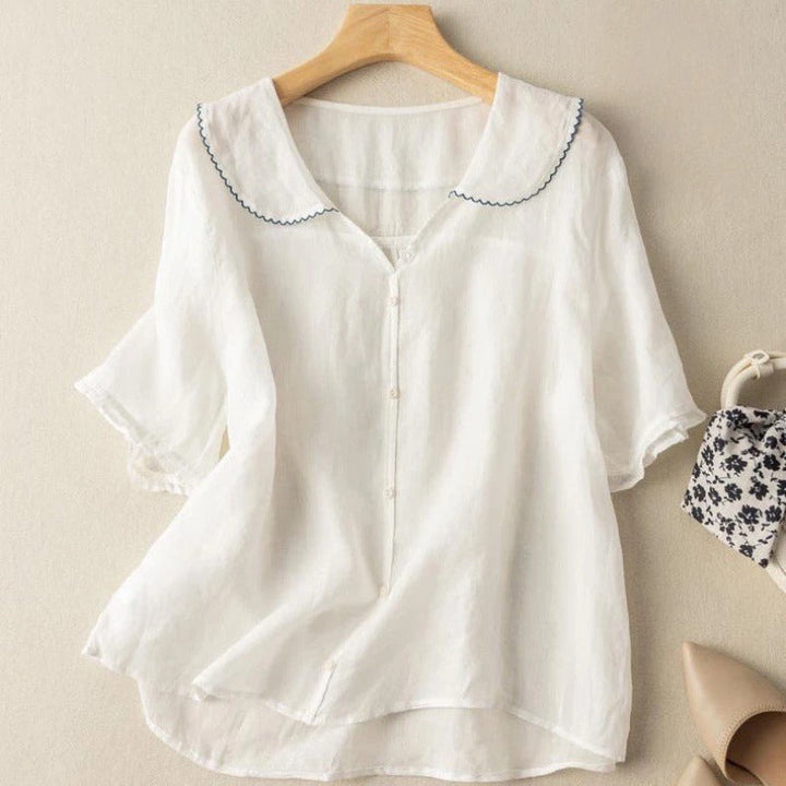 Stylish women's vintage blouse with button front, classic scalloped collar. An elegant and versatile top for women.