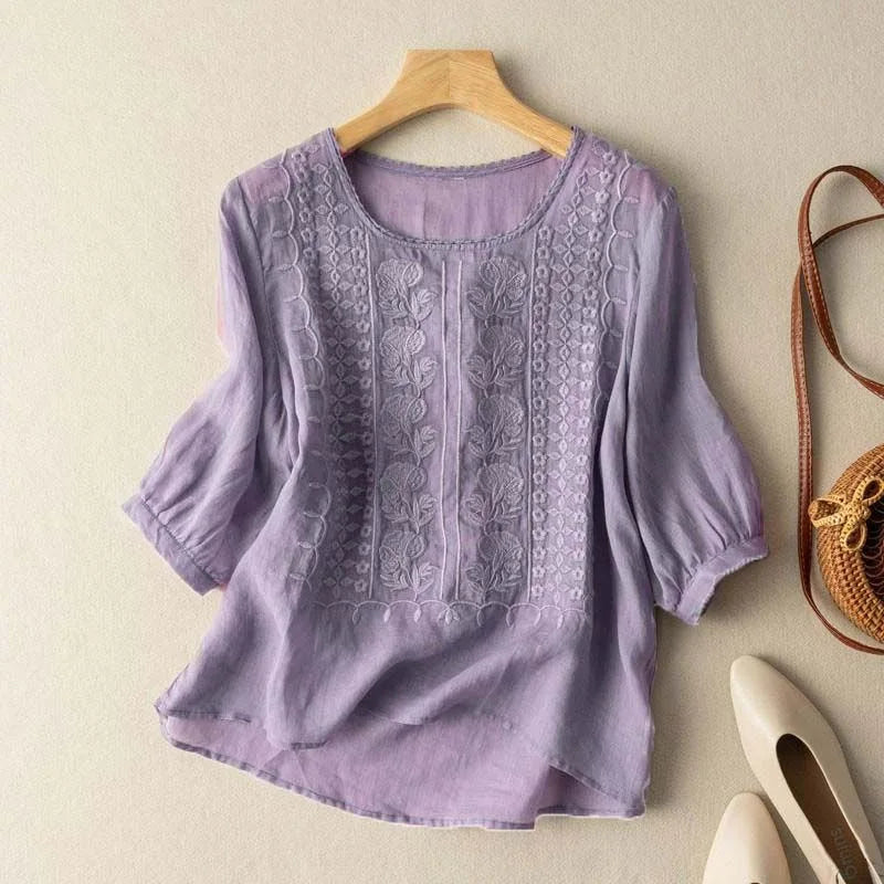 Casual chic women's blouse: vintage embroidery, sheer puff sleeves, round neck. Perfect for stylish everyday wear.