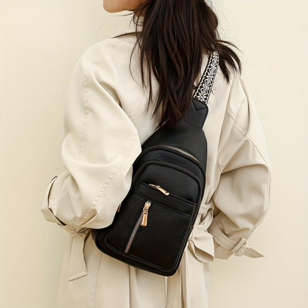 Close-up: Vintage leather crossbody bag texture, a retro style women's purse detail.