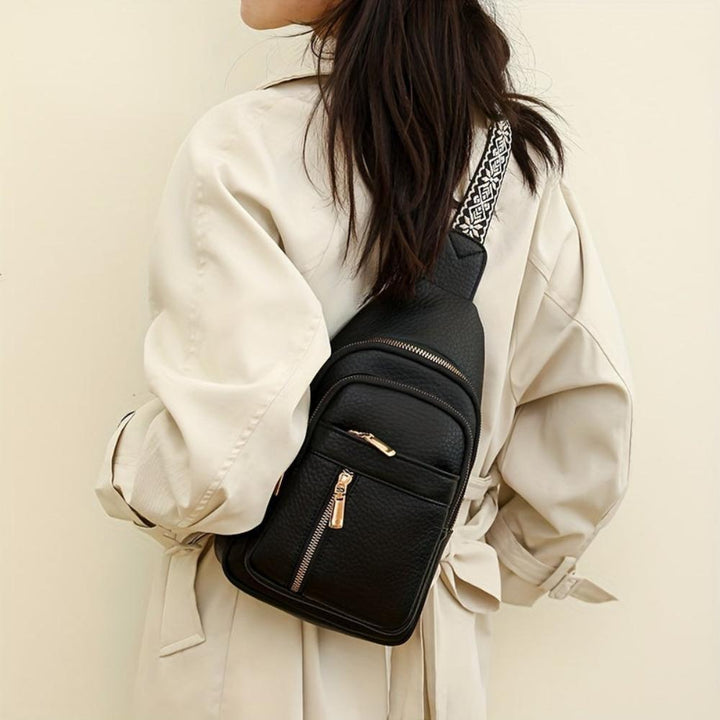 Close-up: Vintage leather crossbody bag texture, a retro style women's purse detail.