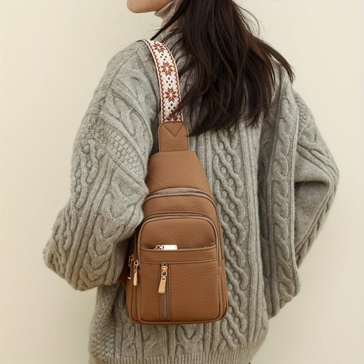 Khaki vintage leather chest bag, a stylish crossbody purse for women, retro fashion accessory.