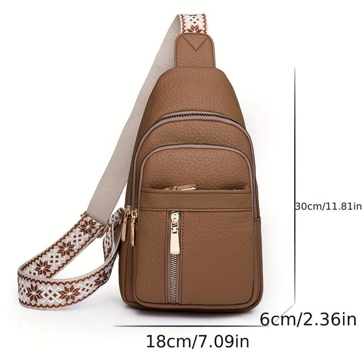 Front view: Women's vintage leather chest crossbody bag, a retro fashion shoulder purse for women.