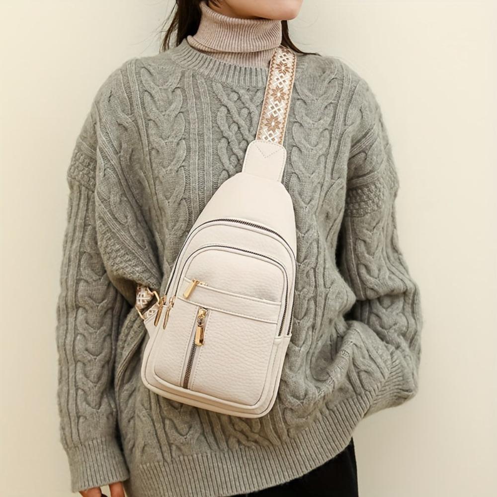 Side view: Women's vintage leather crossbody bag, perfect as a chest or shoulder purse accessory.
