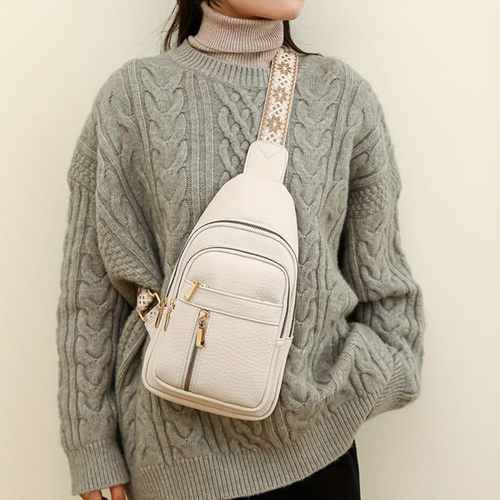 Side view: Women's vintage leather crossbody bag, perfect as a chest or shoulder purse accessory.