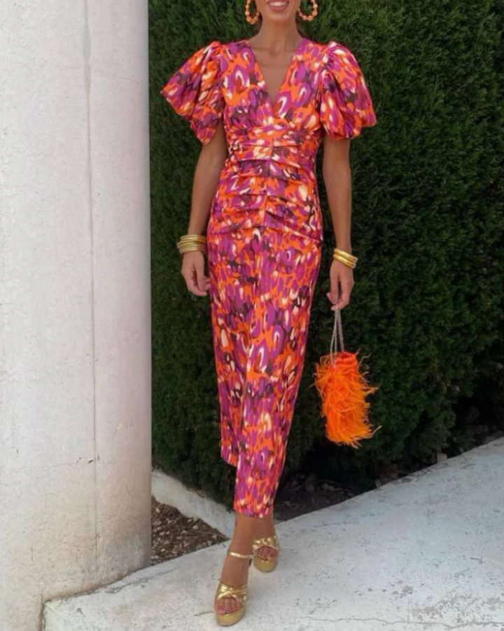 Women's vivid ruched midi dress with eye-catching abstract print. Perfect for party & occasion wear.