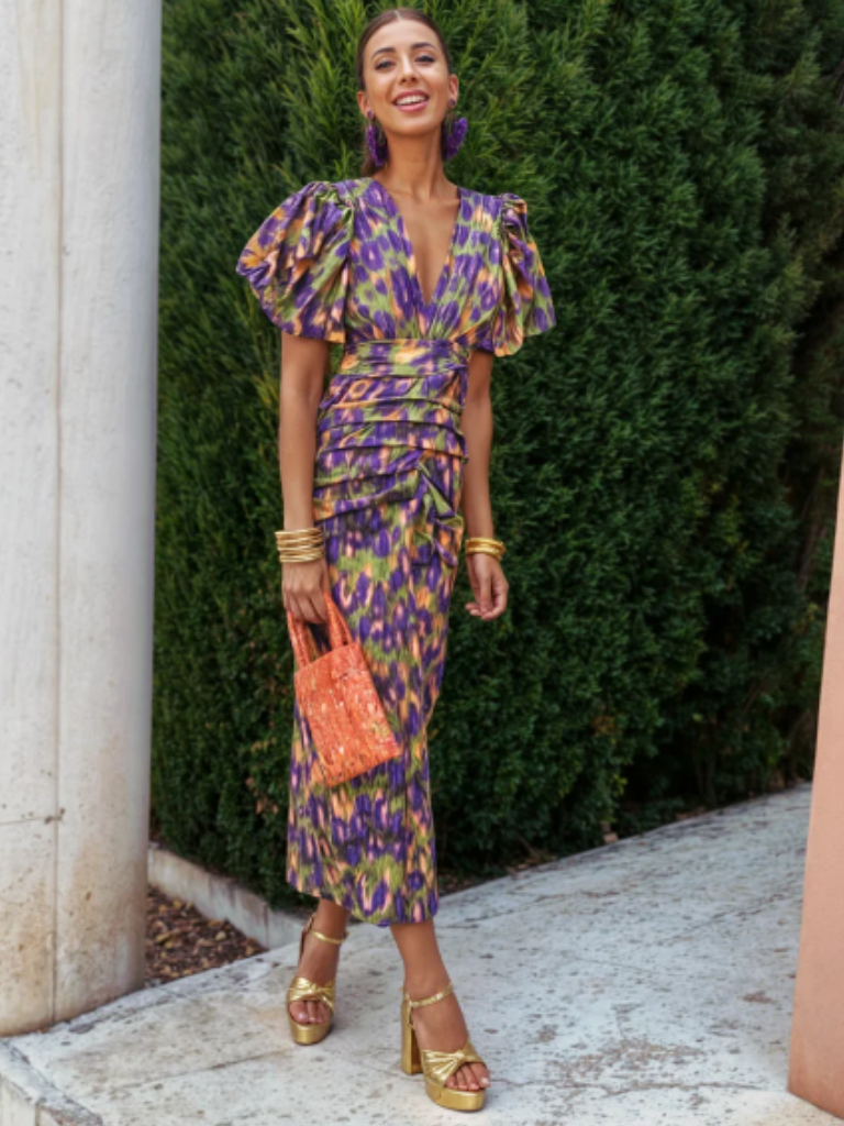 Modern women's abstract print midi dress, ruched detail. Versatile for evening & special occasion fashion.
