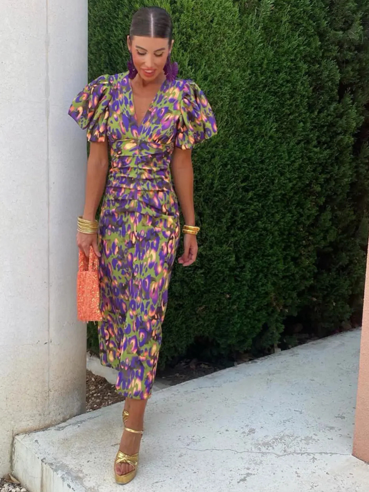 Vibrant abstract pattern ruched midi dress. Women's statement fashion, perfect for any special occasion.