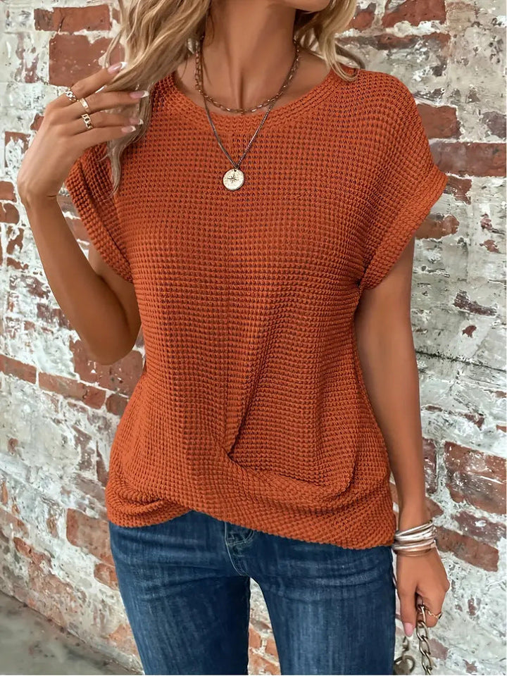 Modern women's short sleeve waffle tee featuring a unique twist front detail. Ideal for casual fashion.