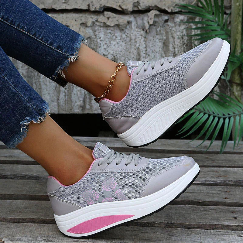 Women's supportive walking sneakers, breathable mesh upper, cushioned for active comfort.