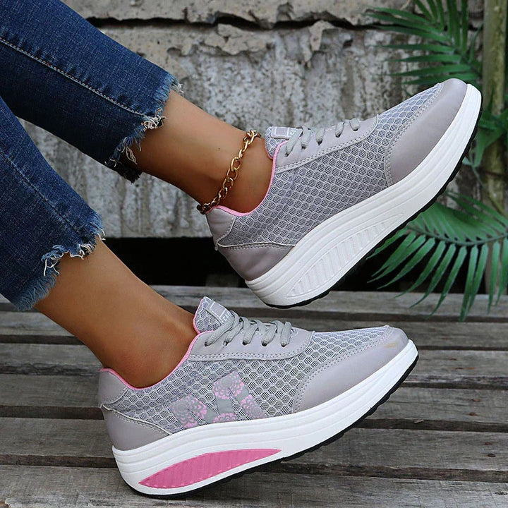 Women's supportive walking sneakers, breathable mesh upper, cushioned for active comfort.