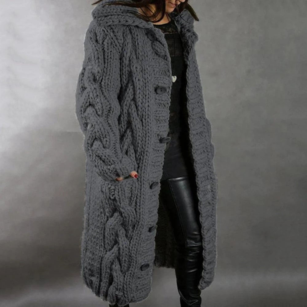 Long knit maxi cardigan for women, featuring a warm cable knit design for cozy autumn and winter outfits.