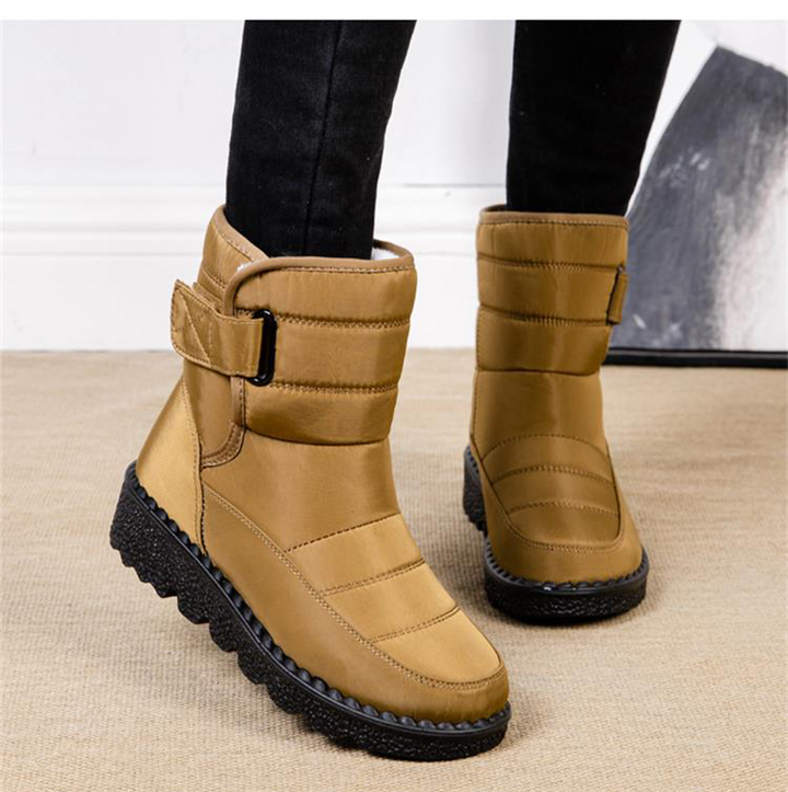 Women's durable waterproof boots for winter. Padded, warm, and non-slip, designed for cold weather.