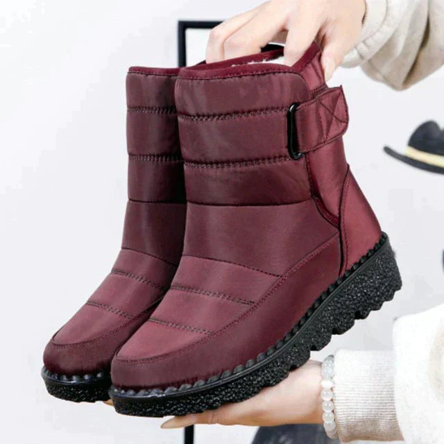Cozy women's snow boots with waterproof protection. Padded for warmth, featuring a non-slip sole.