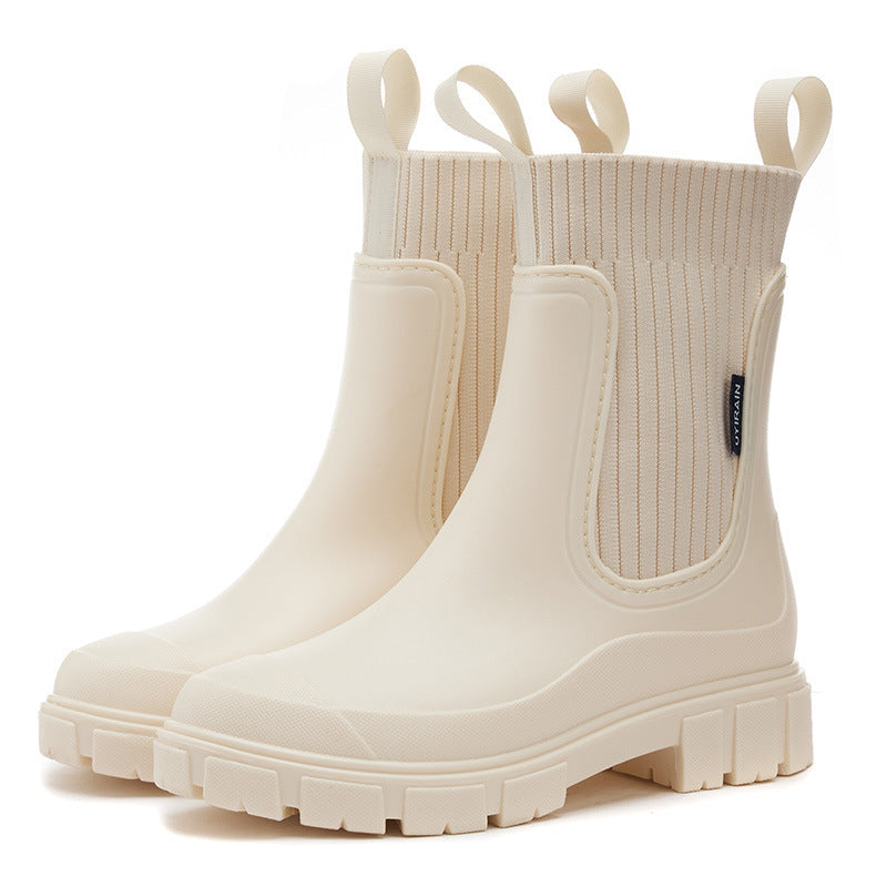 Close-up of a women's waterproof boot, showcasing its durable material and non-slip sole for all-weather protection.