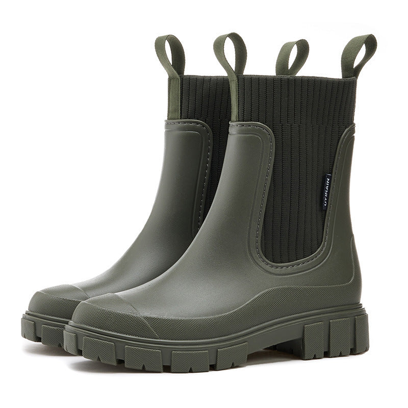 Pair of women's all-weather rain boots, ready for outdoor adventures. Waterproof, comfortable, and stylish footwear.