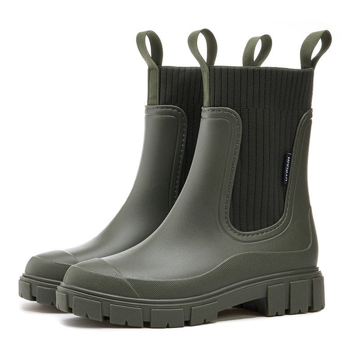 Pair of women's all-weather rain boots, ready for outdoor adventures. Waterproof, comfortable, and stylish footwear.
