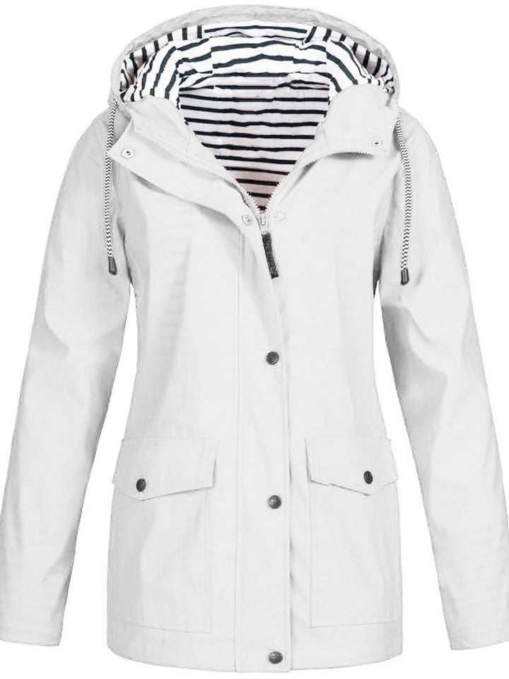 Stylish hooded women's jacket featuring deep pockets, designed for protection from wind & rain.