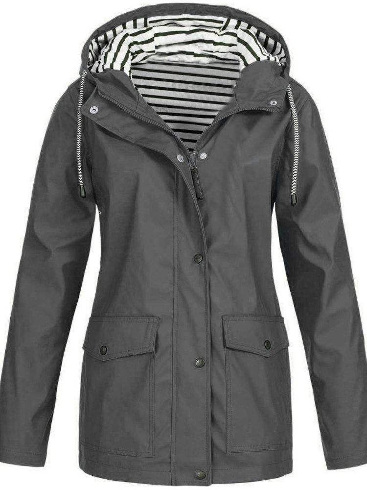 Lightweight women's travel jacket. Waterproof, windproof, with a practical hood & secure pockets for adventures.