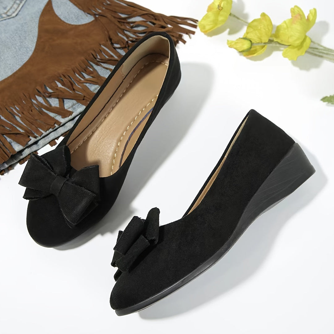 Classic ladies wedge ballet shoes with bow detail, round toe, and comfortable for daily activities.