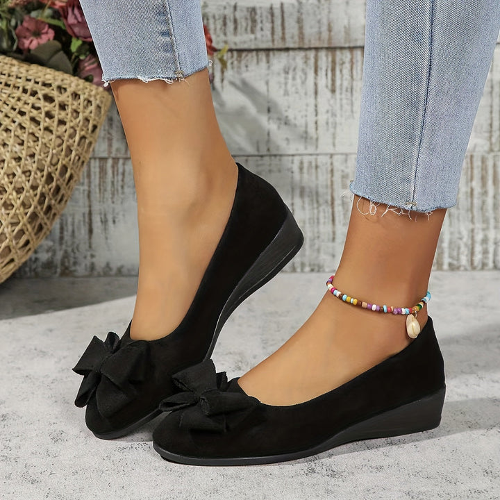Comfortable women's casual wedge ballet flats with bow accent and round toe for everyday versatility.
