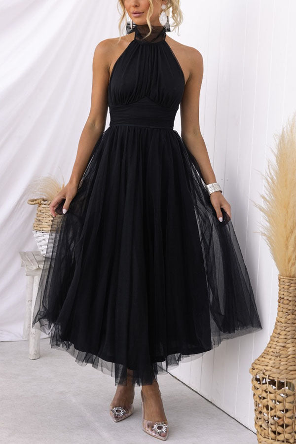 Delightful women's whimsical tulle midi dress, perfect for special occasion or evening wear.
