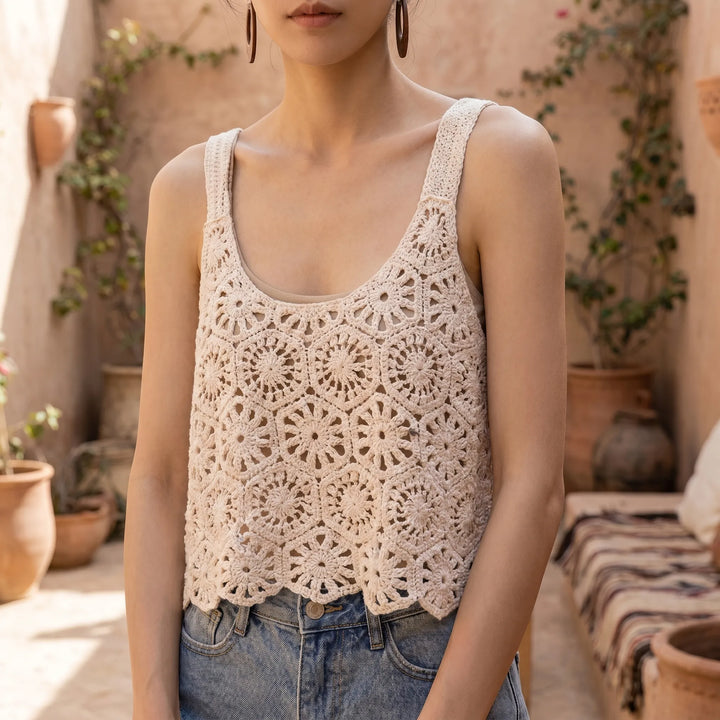 Women's white Bohemian crochet knit sleeveless crop top, perfect for summer beach or casual wear.