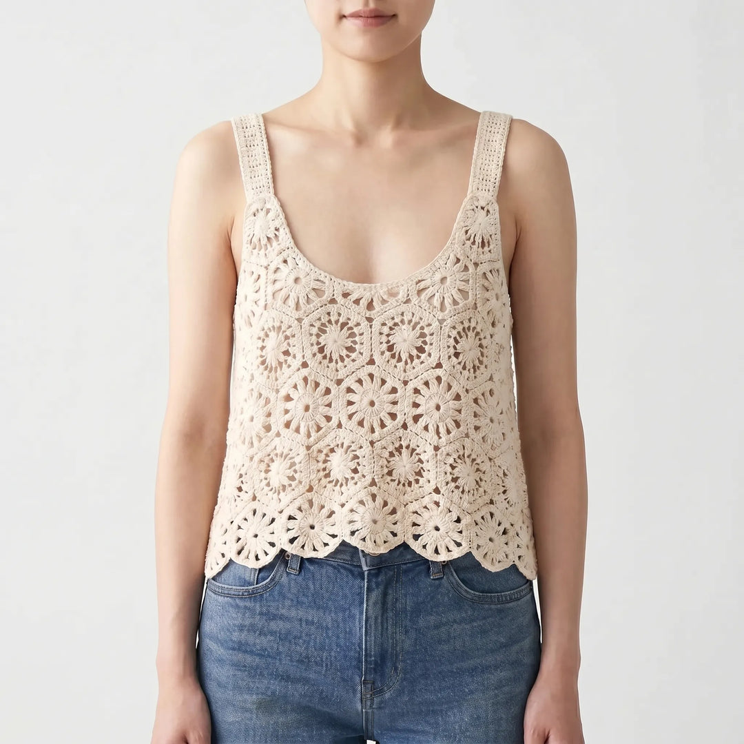 Beige Bohemian crochet sleeveless top with unique knit texture, ideal for vacation or relaxed summer outfits.