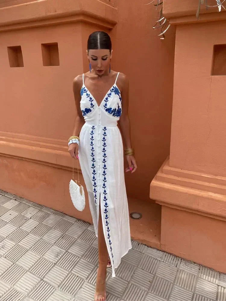 Women's white boho embroidered maxi dress with a V-neck, perfect for wedding guests or summer vacations.