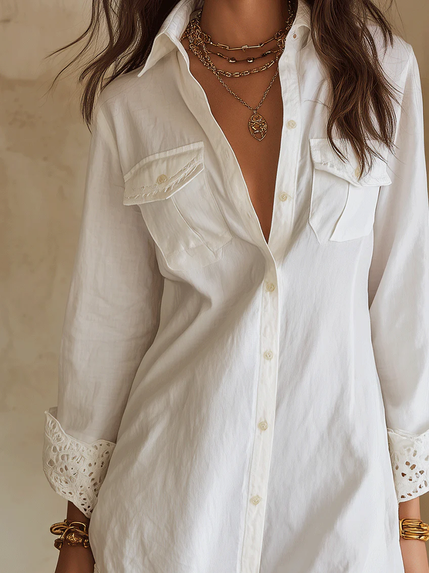 Chic white mini shirt dress for women with collared button-front & crochet hem. Versatile for casual, beach or vacation.