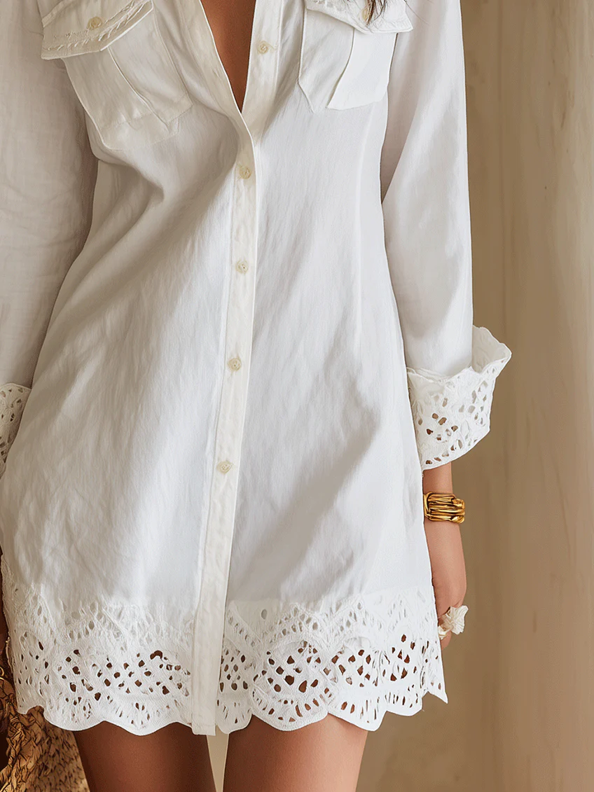 Boho women's white collared shirt dress with button-front, long sleeves & intricate crochet hem. Ideal for beach cover-up.