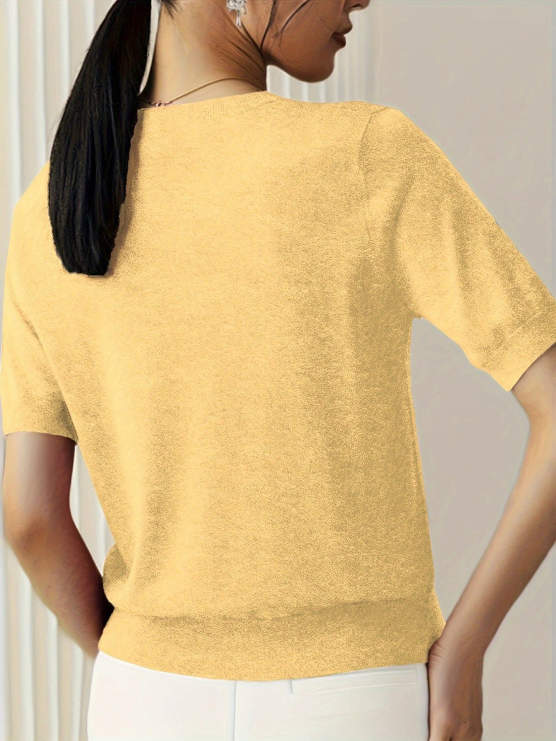 Slim fit women's white ribbed short sleeve tee, crew neck top designed for a sleek look.
