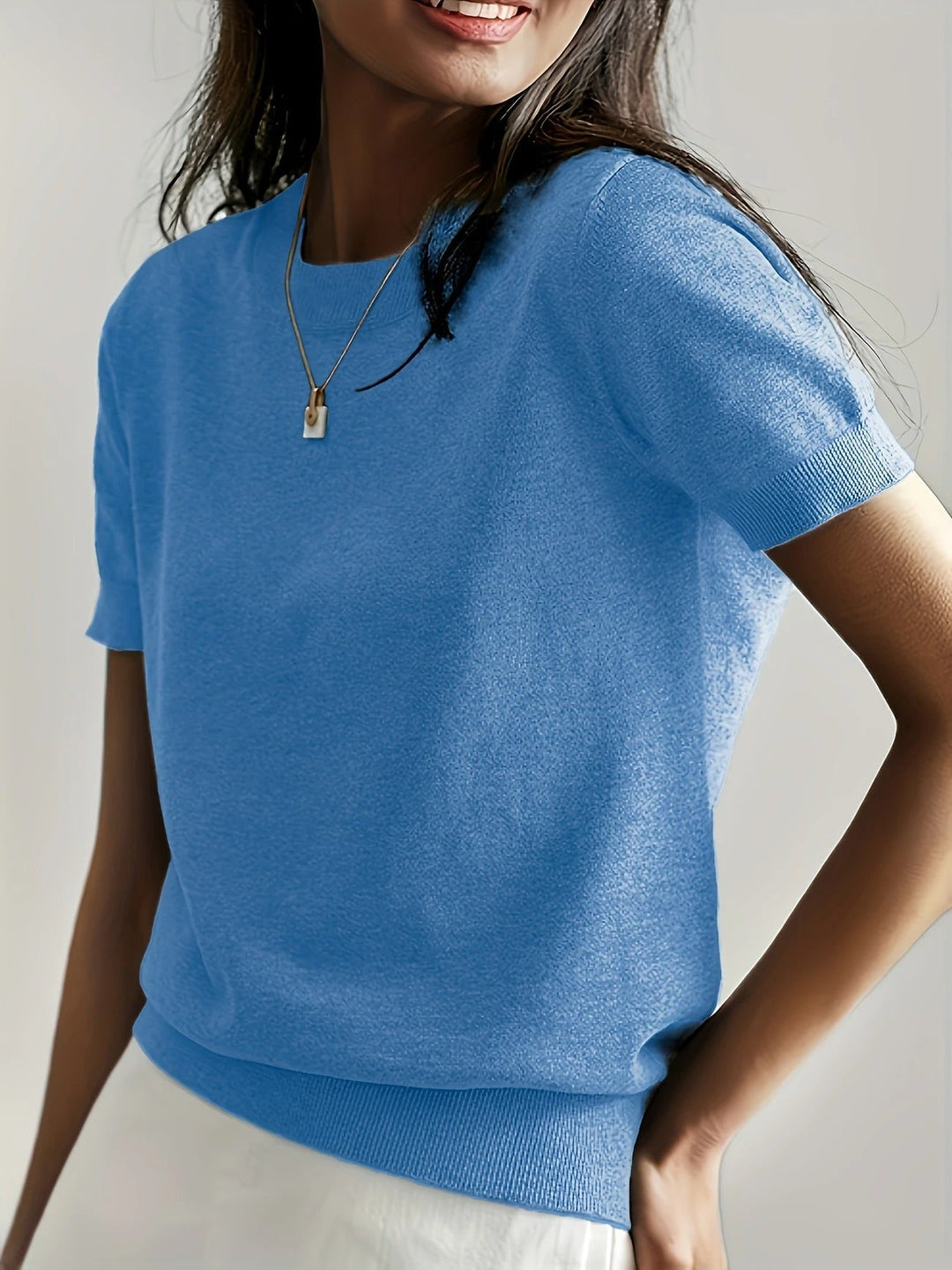 Relaxed fit women's black ribbed short sleeve top, comfortable crew neck everyday tee.