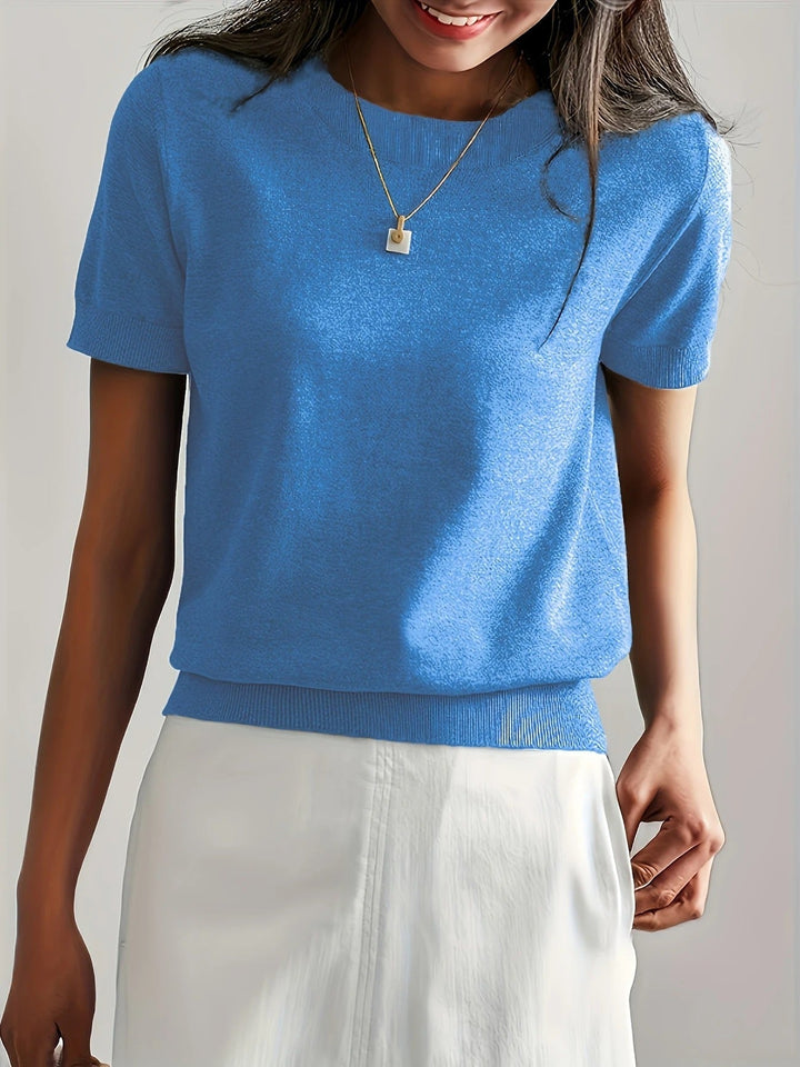 Breathable women's navy crew neck ribbed short sleeve tee, ideal for warm spring weather.