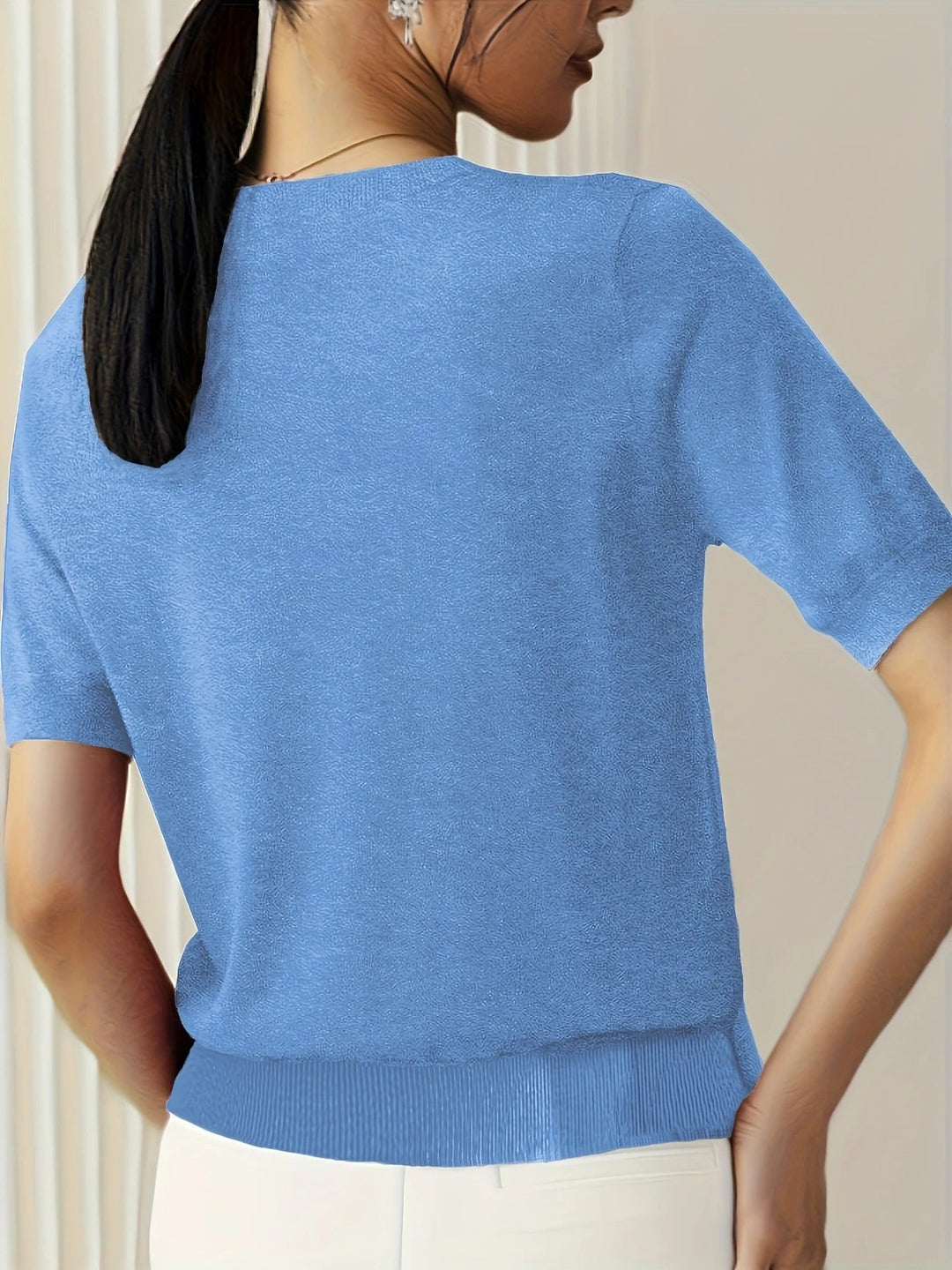 Stylish women's pink ribbed short sleeve tee, crew neck design for versatile dressing.